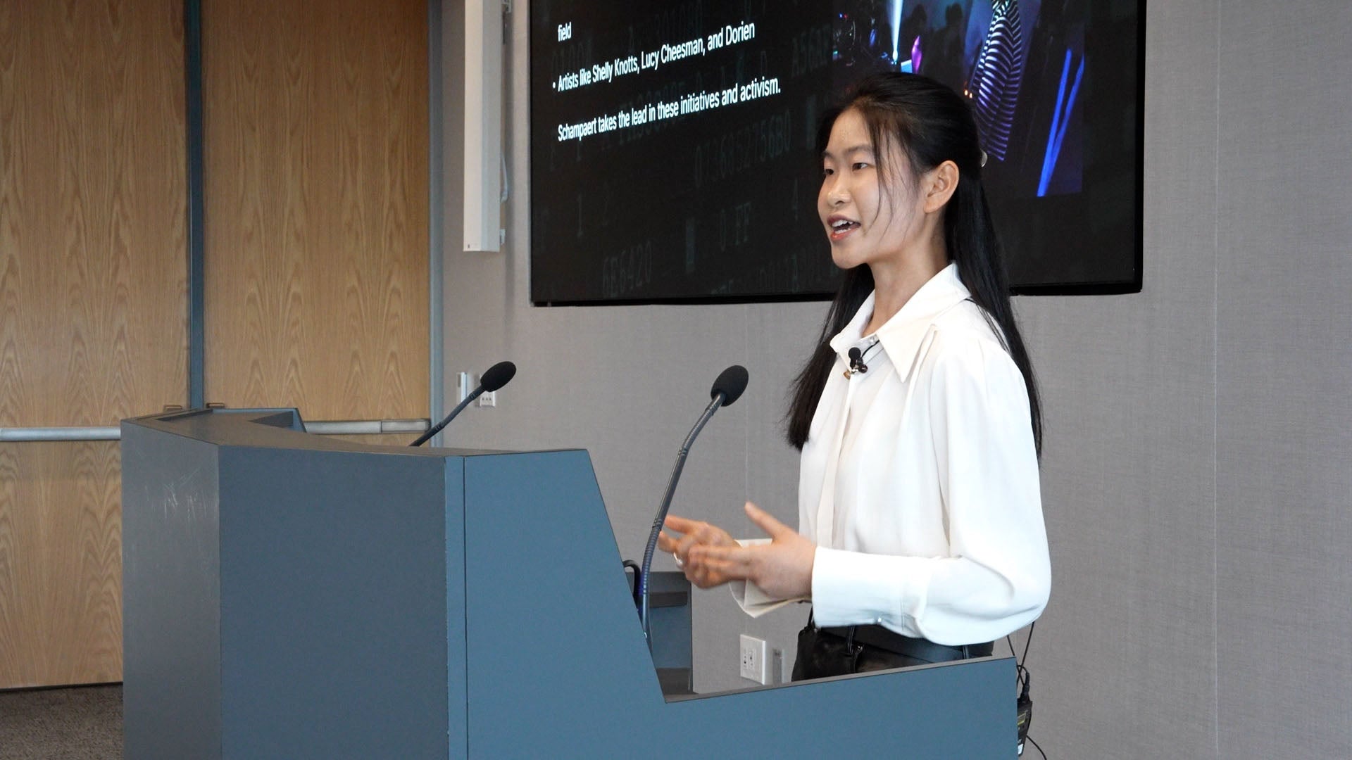Wenchi Shen presenting at the 2025 symposium