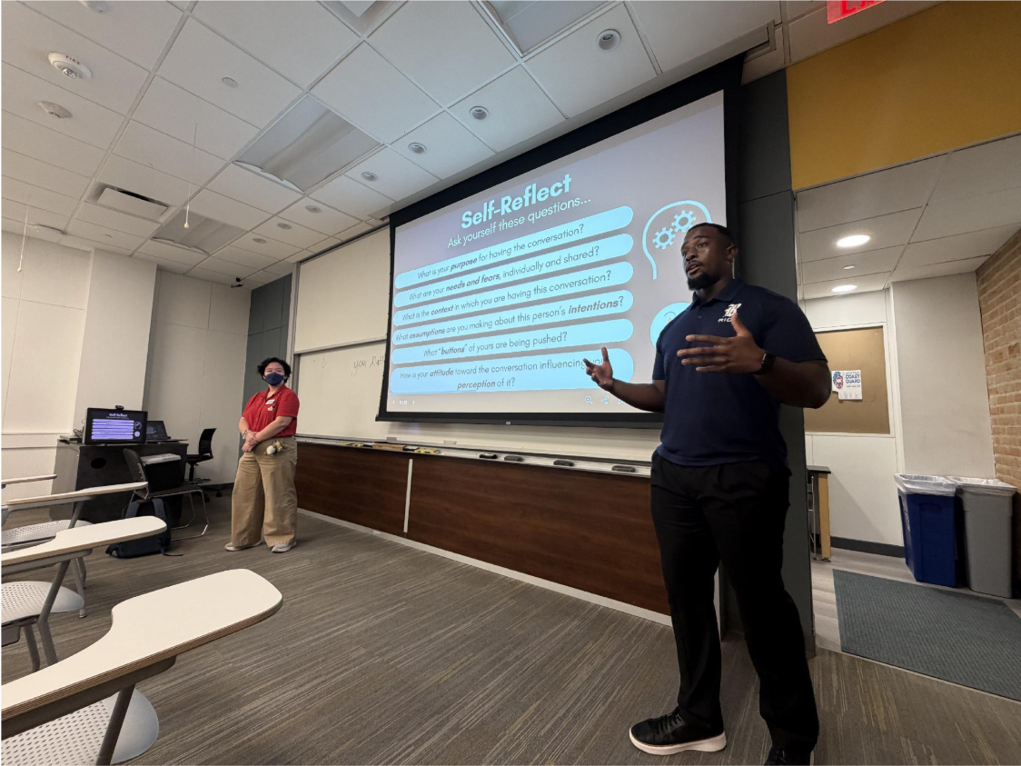 Grant Stephens and Anya Tsang presenting in a classroom