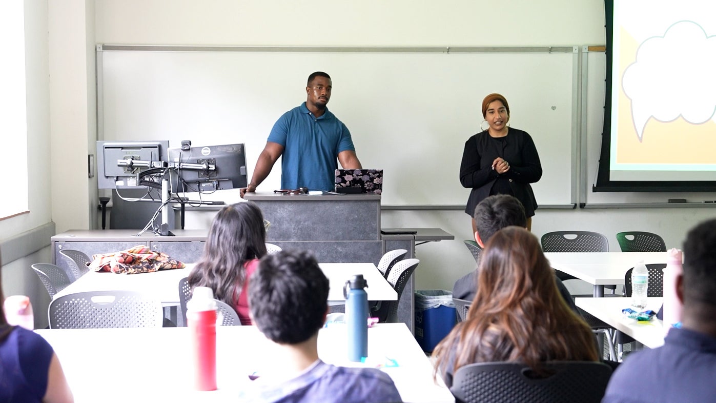 Grant Stephens and Sana Patel presenting to a group during Owl Launch 2026